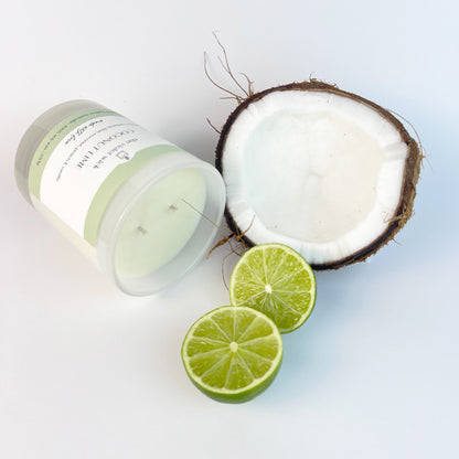 Coconut Lime scented soy candle from The Violet Wick in a glass jar, lime slices and coconut, 250g.