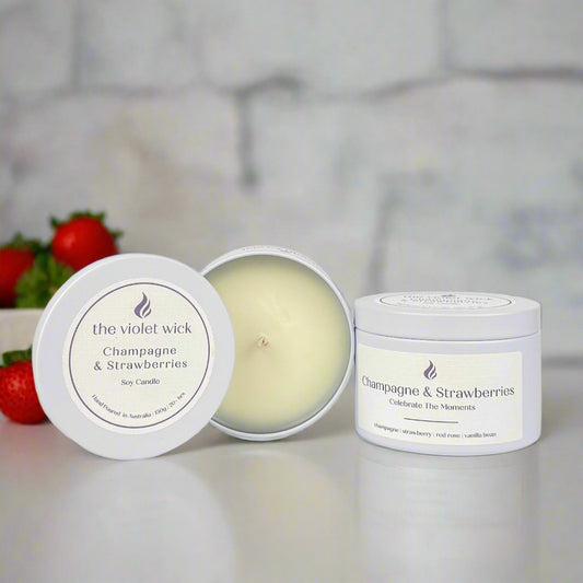 Champagne & Strawberries candle in white tin from The Violet Wick