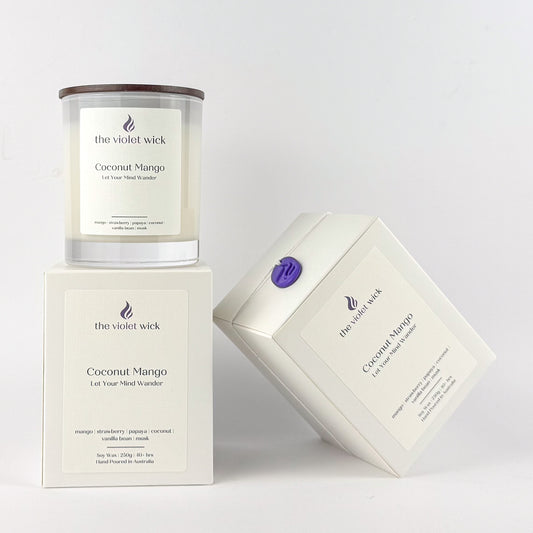 Coconut Mango soy candle by The Violet Wick on a white background