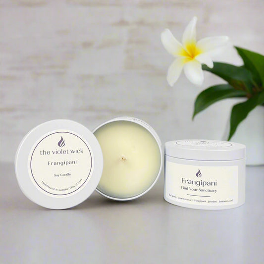 Frangipani candle in white tin from The Violet Wick
