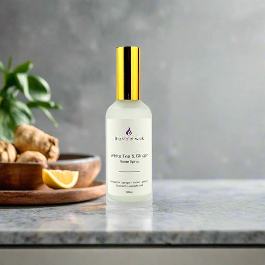White Tea & Ginger Room Spray by The Violet Wick with ginger and lemon in background